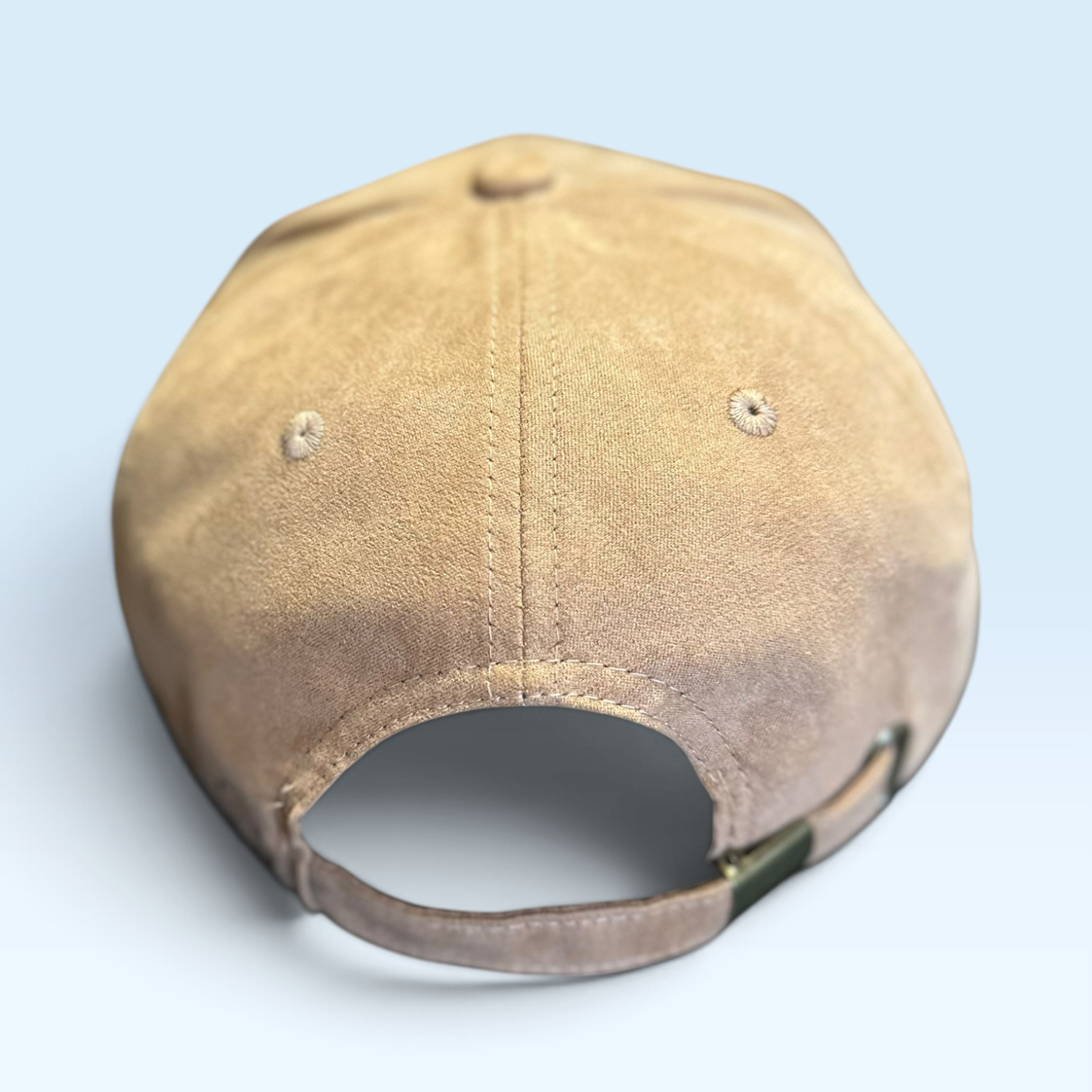 Back view of light brown vegan suede ball cap with adjustable strap and buckle closure.