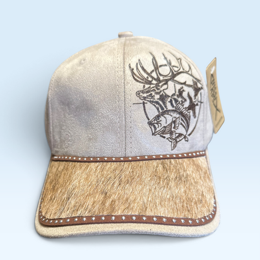 A baseball cap with a light beige suede crown, a real brindle hair-on cowhide brim, and a hand burned graphic of a deer, fish and ducks on the front. 