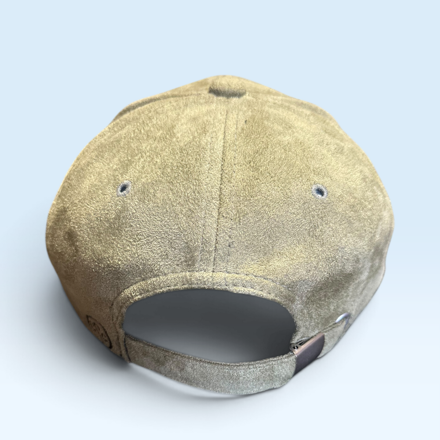 Back view of moss green vegan suede cap with adjustable metal clip buckle.