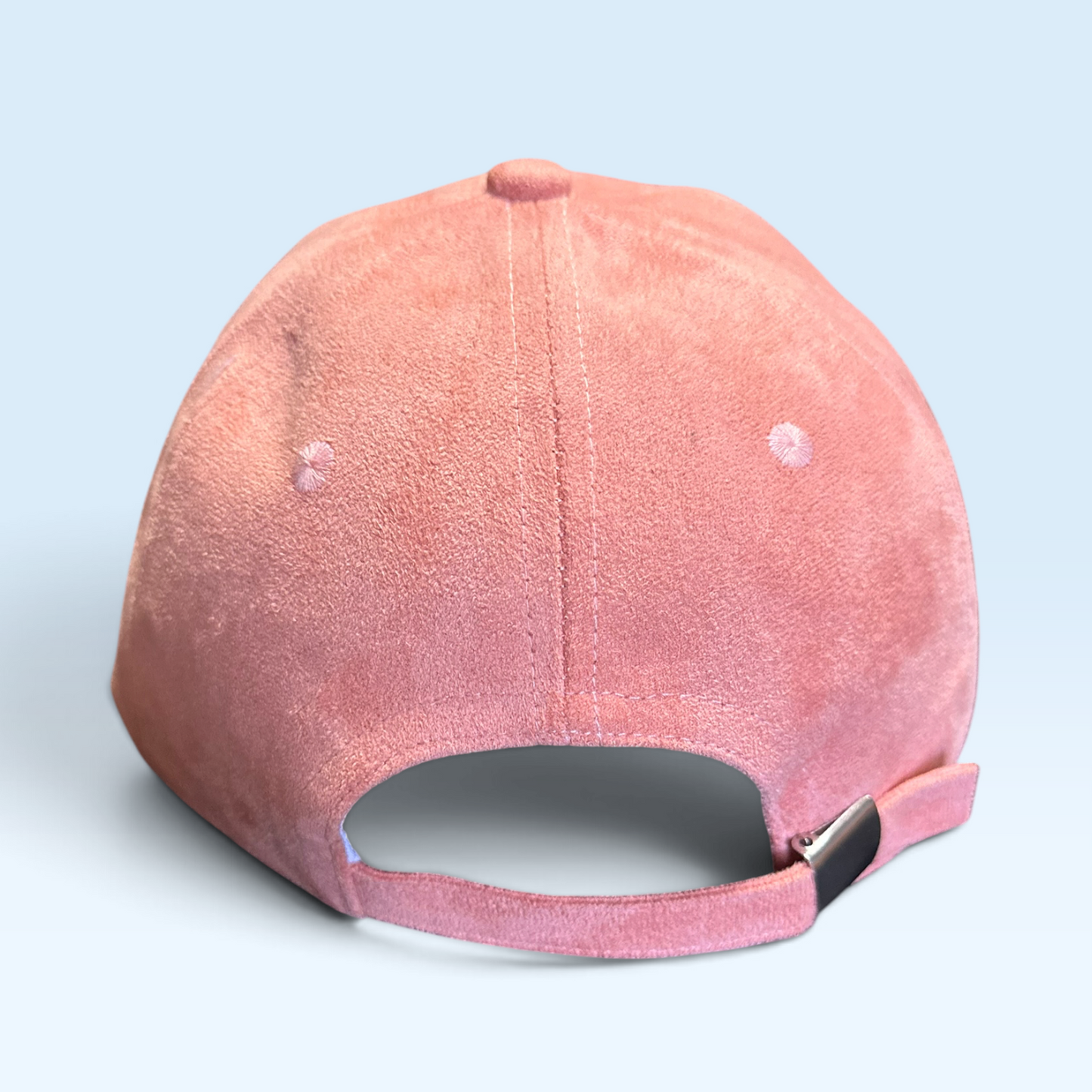Back view of cap with strap and metal buckle closure