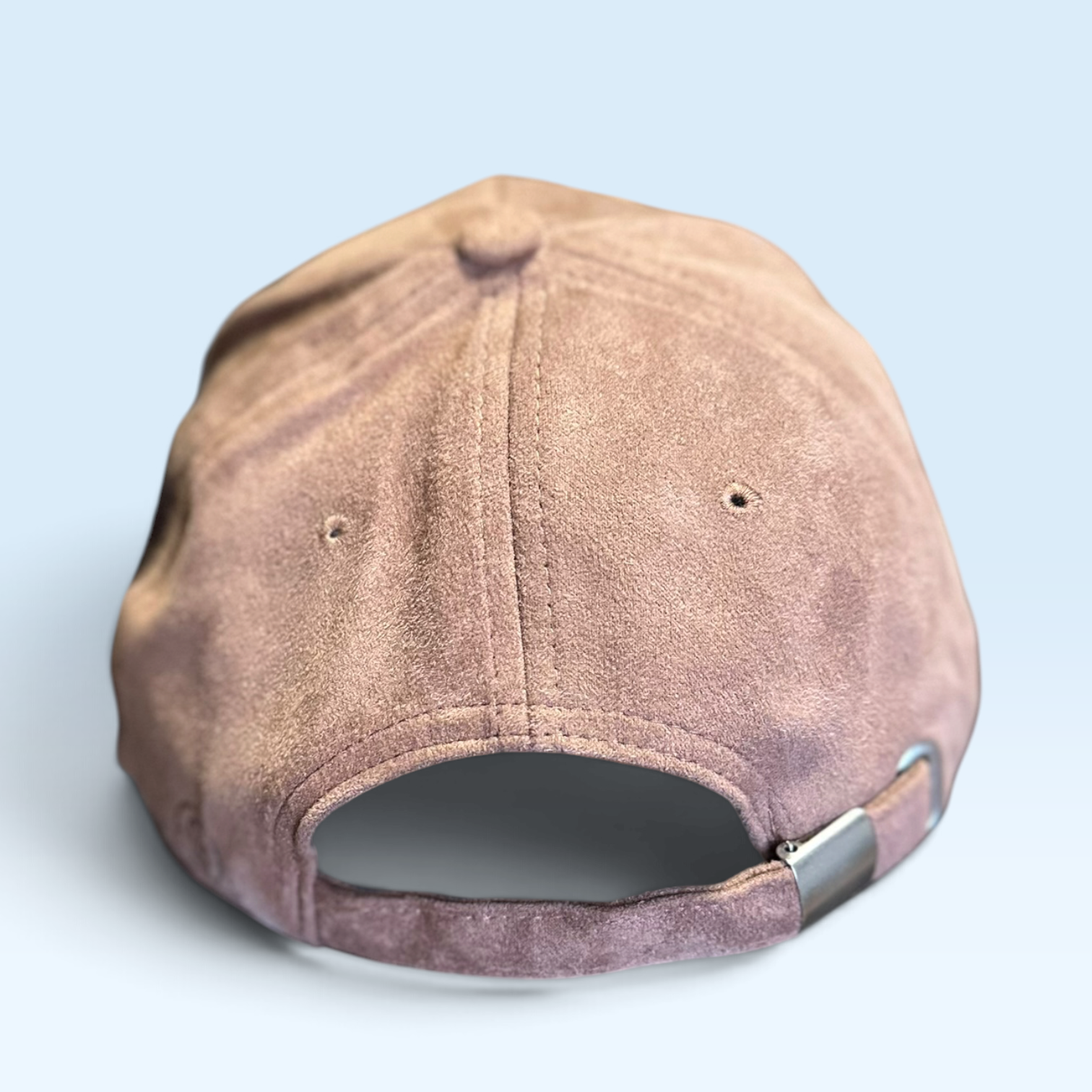 Back view of brown vegan suede cap with adjustablele strap and metal buckle closure